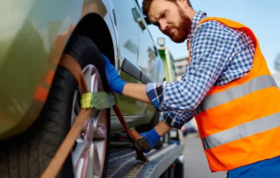 tow-truck-operator-fixing-car-platform